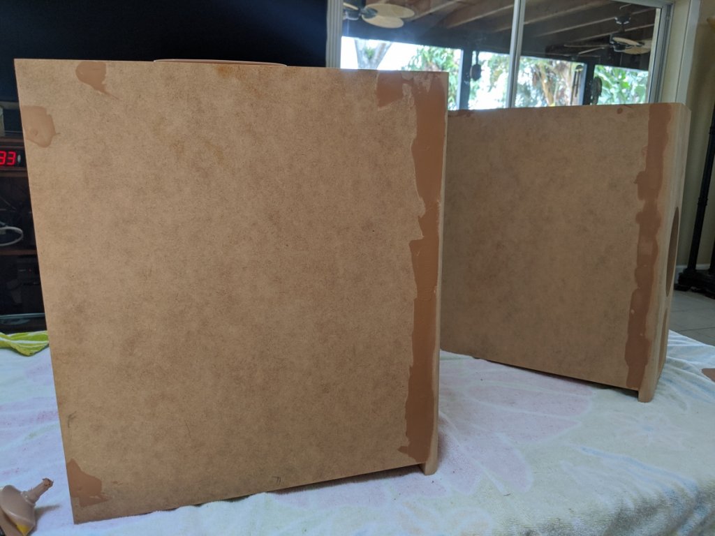 Filling cracks with wood putty before additional sanding