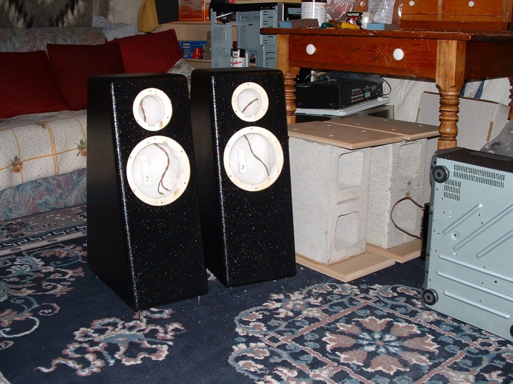 Custom painted cabinets (left)
Building spkr stands with cement blocks (right)
Added wheels at the finish of course!