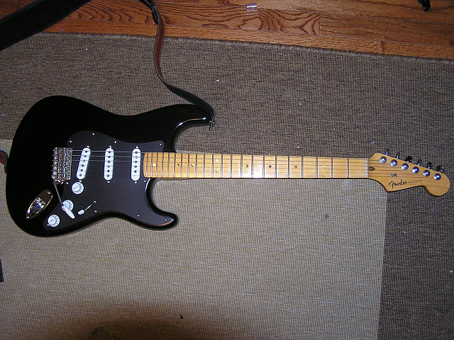 Fender USA Stratocaster. 2008 Fender body (nitro); 2008 Fender Deluxe neck; Seymour Duncan SSL-5 in bridge; Fender CS '69s in mid and neck; locking tuners; Callaham hardware.

The flash makes the pickguard look a lot different in color than the body.