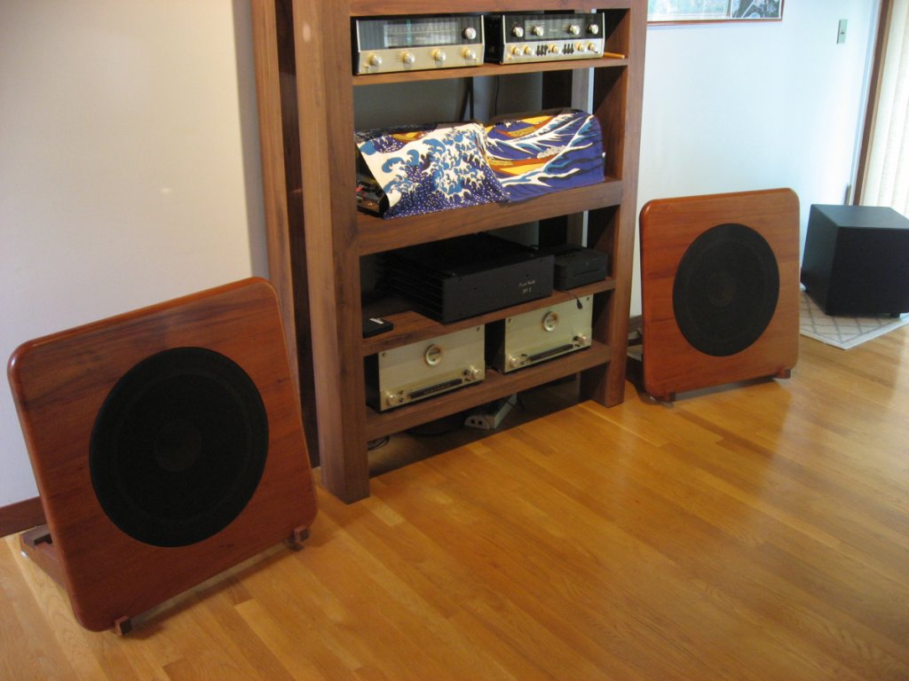 I started out by building solid mahogany baffle boards (28" x 28" x 1.8") for the Lii-Song F15, with flush grill rings. Also, floor stands with adjustable tilt.