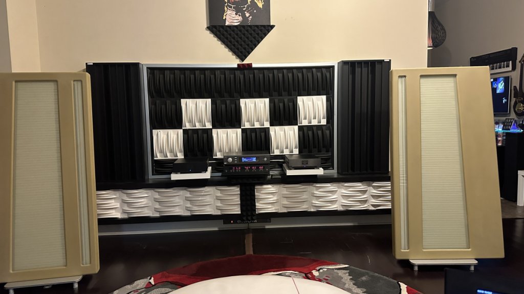 GIK QRD diffusers flanking each speaker. Center black and white panels are mostly cosmetic.