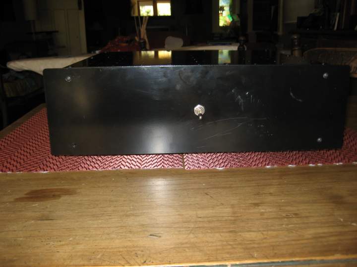 The plain black front look, well broken in already with a few marks and a missing screw.