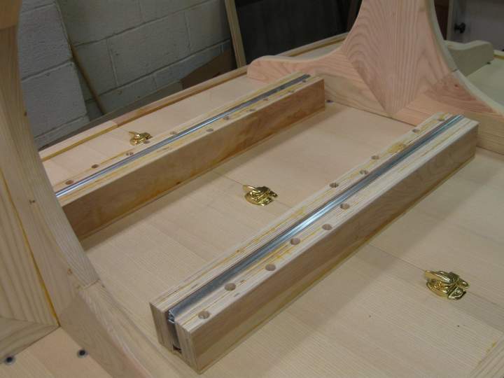 Table sliding mechanism made from heavy duty slides.