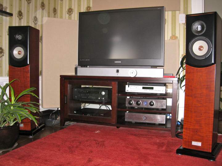 My complete system. When I'm listening, a blanket goes over the TV to reduce reflections. The listening couch is about 8' back from the speakers, pretty much against the back wall.