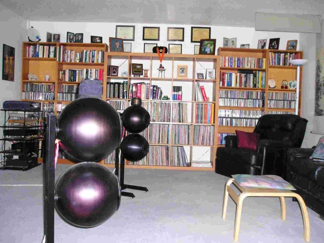 Music and Literature Library: Approximately 1200 CDs, 800 LPs, and 250 SACDs & DVD-As along with a few books. Notice the Magnepan MMG-W hung from the ceiling in the far right-hand corner for surround sound. Obviously there’s another one on the other si