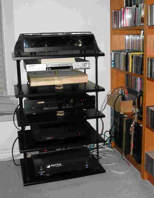 Gear Rack: From top to bottom, Rega Planar 3 with Linn K-9 cartridge, modified Pioneer DV-563A, Parasound PSP-1500 analog multi-channel preamp, Hafler DH-120 (for now). Equi=tech 2Q Balanced Power Unit. On the right bookshelf is a Bottlehead Seducti