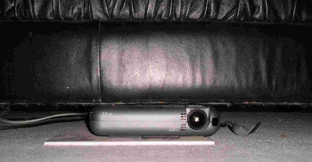 NEC LT150 DLP Projector: Tucked under the couch right below the listening seat ready to shoot to a…