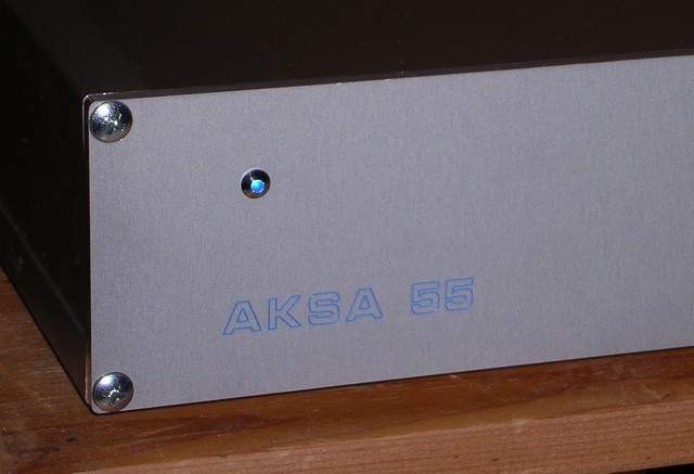 The engraved AKSA logo