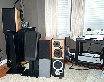 From L to R:
Usher X-718, GMA Europa, Usher S520, and below them are KEF Coda 70's...... Disclaimer: These were setup for a photo, not for listening (duh)...