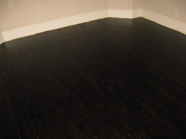 The floor is finished.

2 coats of Transtint mixed with denatured alcohol
4 coats of Waterlox sealer
2 coats of Waterlox Satin Finish