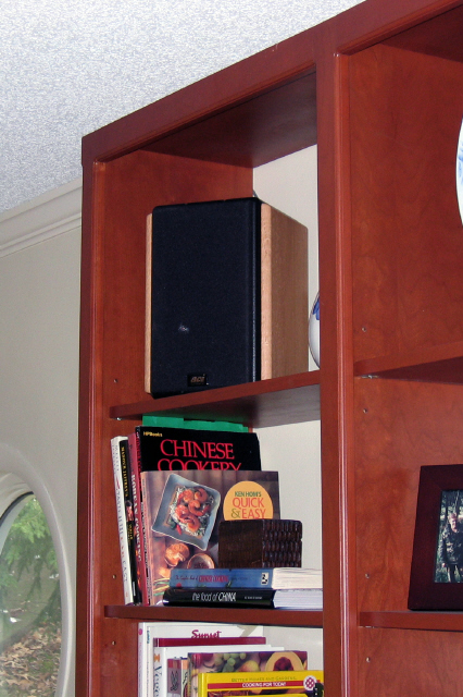 Emerald as a surround speaker in a bookshelf