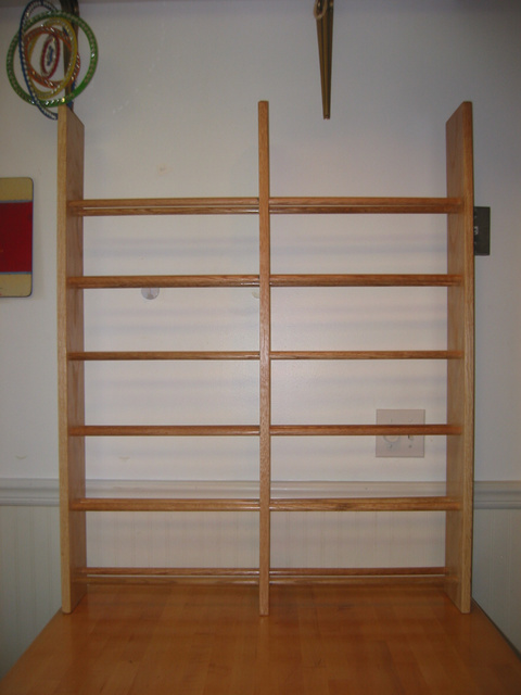 materials: 1x6 red oak, 5/8 inch solid oak dowels, Elmers woodglue.
approx mat'l cost: $80. 
approx labor time: 6 hrs (sanding and staining took most time)