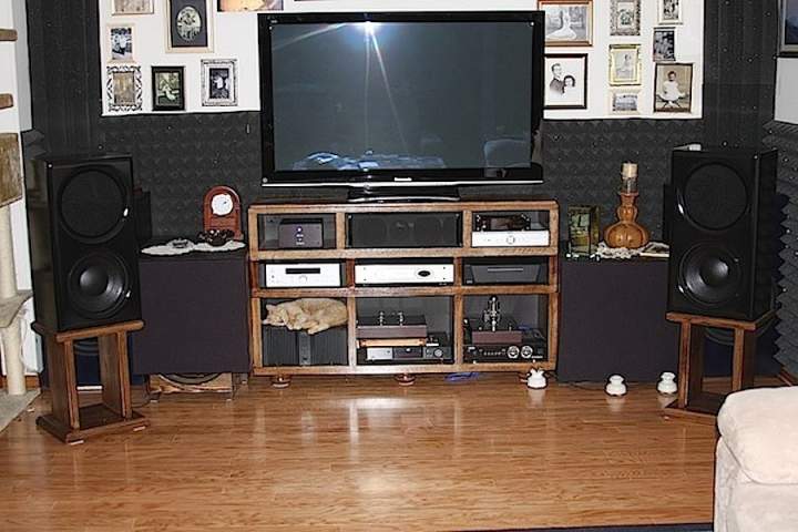 (Untitled)
This is the current picture of the system. The carpeted flooring is gone, as are the sono tube enclosures for the LFE subs. They are now in their new enclosures one in each corner.