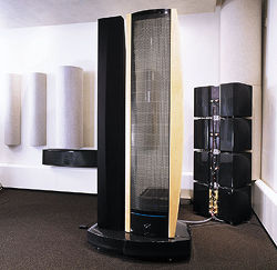 Gayle Sanders' basement home theater. Although I'm not a huge fan of the smaller Martin Logan speakers, the E2 is a different beast and may be the perfect speaker -- electrostatic panel operating seamlessly from 200hz up, 7