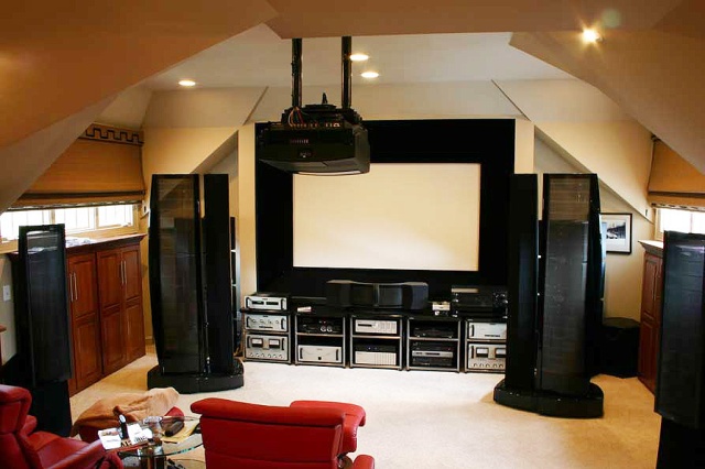 This is what happens when you allow a dealer to do install your home theater without any guidance. Just bring the gear and write a check! Notice all the nice Audio Research tube gear placed in non-ventilated racks. And what on earth is a Descent subwoo