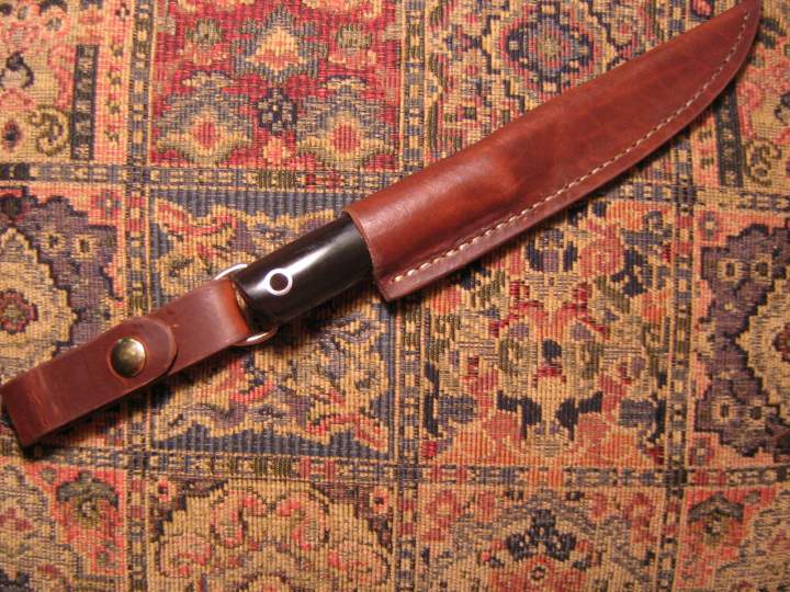 Trout knife with detachable extension for wearing in a higher position. I made this my personal knife. Very sharp, sturdy and versatile. I am really enjoying it.