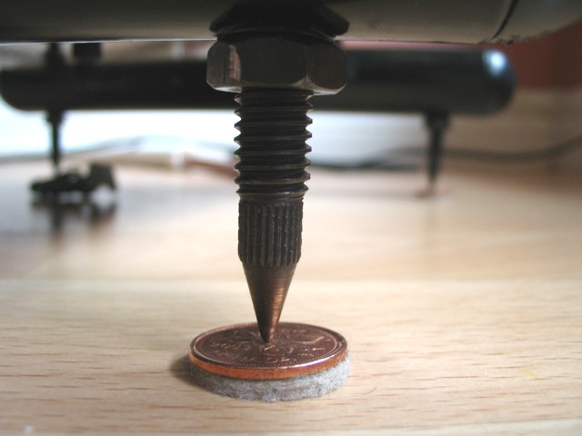 Speaker stand spikes are resting on pennies with felt. Works great for fine tooning speaker placement
