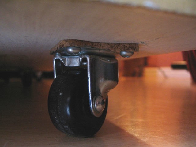 Because the Sub is heavy (Approx. 50lbs), I installed 6 wheels so I can move it around. The cork costers were used to isolave vibration from sub to floor
