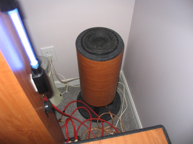 My little Tang Band music sub hiding in the corner in a mess of wires.