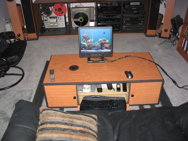 The middle door of the cabinet opens up to reveal a spot for my half dozen remotes and my computer keyboard.