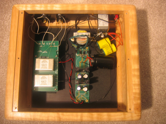 Poseidons Voice RAKK dac-interior view w/power supply using Jensen 4 pole caps, Black Gate FK caps, Sanyo Oscon caps, and ERS and constrained layer dampening sheets.