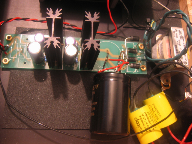 Poseidons Voice RAKK dac-interior view w/power supply using Jensen 4 pole caps, Black Gate FK caps, Sanyo Oscon caps, and ERS and constrained layer dampening sheets.