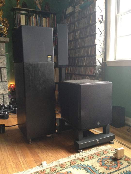 KEF 107, JL F112 on Sound Anchor subwoofer stand with Synergistic Research Art Basik Bass in foreground