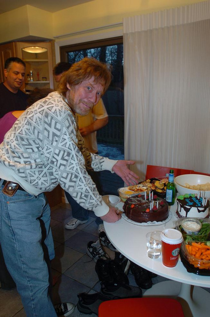 Gordy cutting the cake