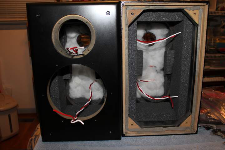 Pictures showing front baffle board installed. Also, 1 oz of Acousti-Stuf installed in the rear of the cabinets.