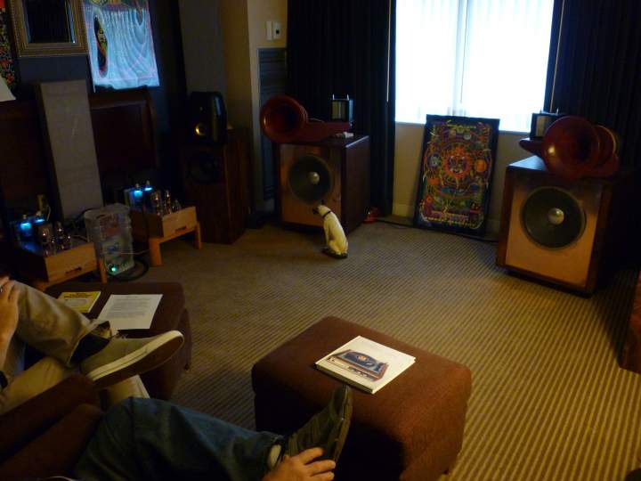 Southeast Michigan Audio Club (SMAC) room at AKFest 2012 featuring DIY speakers using Heil drivers from a pair of AMT-1 speakerrs (see Mwhell's room to find out what happened to the bass bins :^)). DIY tube amps can just be seen off to the left. Triangular subs in the corners behind speakers.
