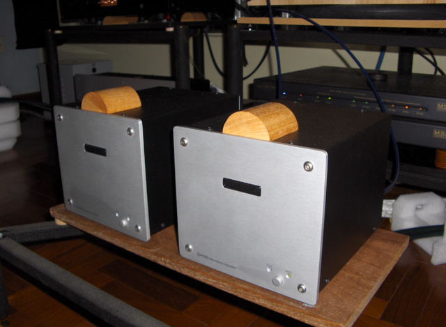 Placing a little block of wood on the amps make the sound a little more organic.