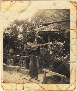 young doc w guitar 300