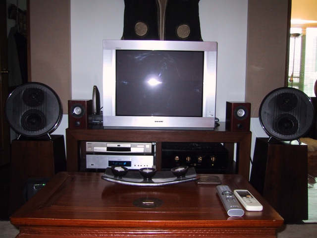 Doorways on either side of the speakers, Echobuster acoustic panels behind each one. Little RAD Micro speakers being broken in