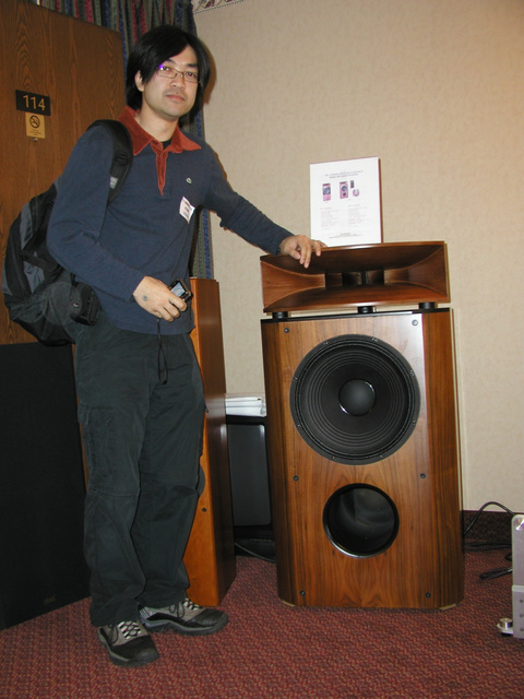 Buddy next to the speakers