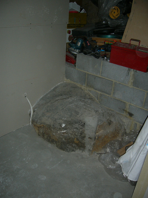 my pet rock, going to cost excessive amounts to remove, so i just built over it!!