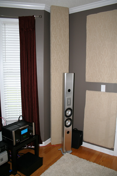 Traps, panels, and Piega's oh my - The panel behind the speaker is a 9' x 1' x 4" bass trap.