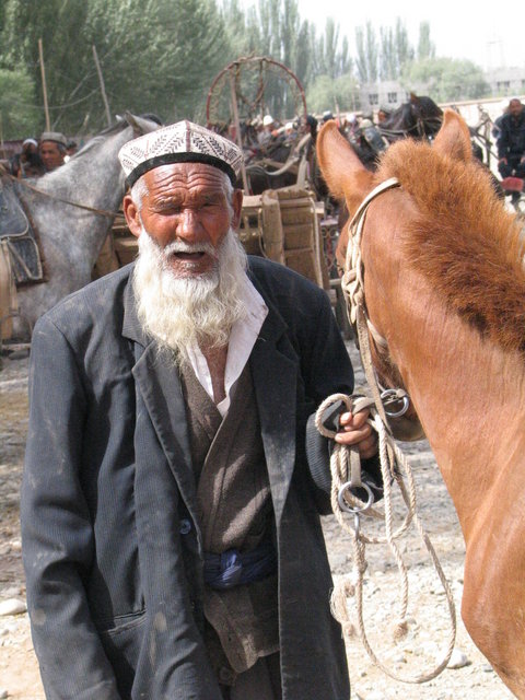 Man & his horse at the Livestock market in Kashgar