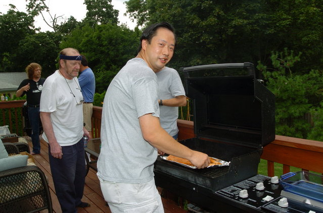 Phil on the grill cooking salmon