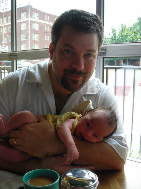 Me and the Boy - At breakfast when Kai was about 6-7 weeks old. Cute, eh? And the baby isn't bad, either ...