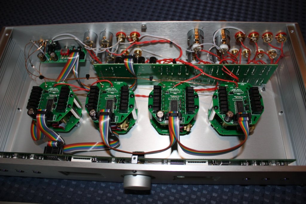Top cover removed. Closeup of internal circuitry. 4 Intact Audio autoformers. Signal wire is Ohno continuous cast. Ground wire is enameled magnet wire as well as 24 gauge (0.25 mm) gold plated copper from Scientific Wire Company.