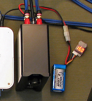 MG3 with four-cell 1000 mAh LiPo battery (16.8V fully charged to 12.0V discharged) a voltage monitor with audible alarm (that's programmed to alert at 3.0V per cell).
