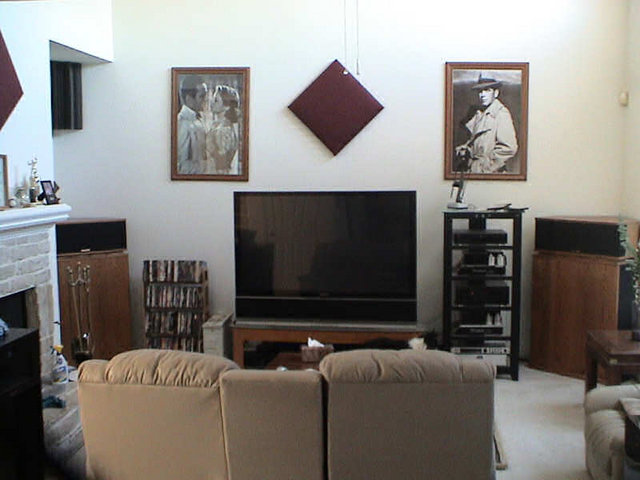 Front of listening room. 2'X 2'X 1" acoustic panel (wine color).