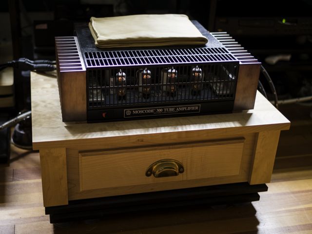 Moscode 300. Dual Mono Monster designed/modified by George Kaye. Two large transformers hidden by maple cabinet that amp sits on/in. Sounds sweet and powerful.