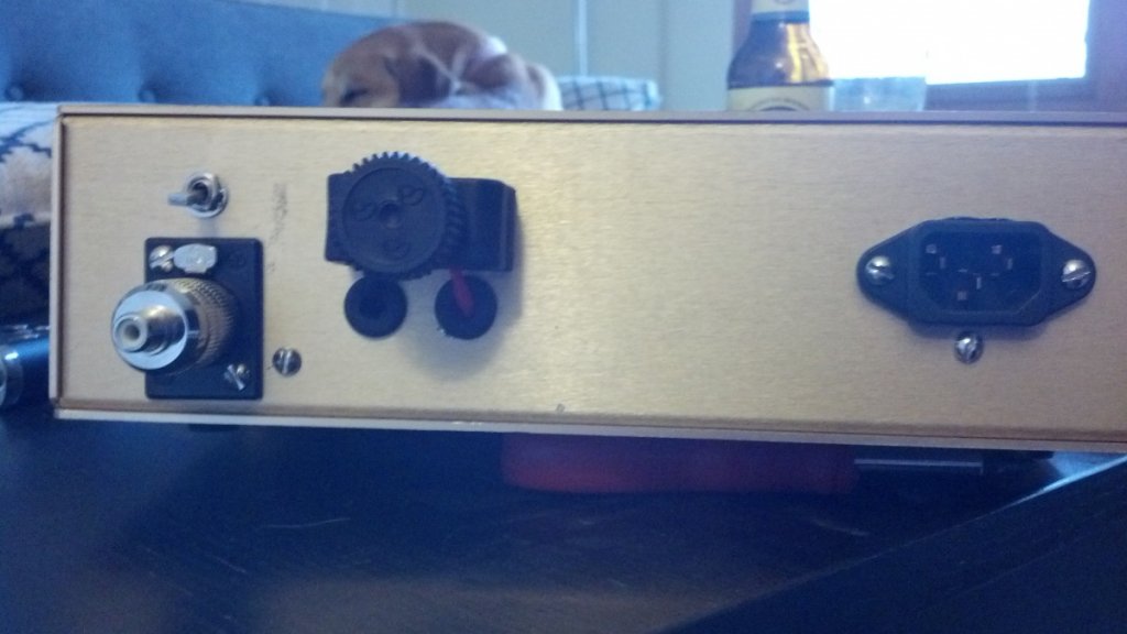 Rear with grommet holes for speaker cable visible