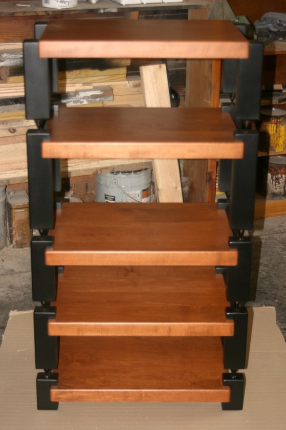 Maple Rack with Teak Stain and Black Post. Finish is Satin Lacquer. Each shelf is individual and can be stacked to suit your spacing needs. They can also be used apart by themselves.