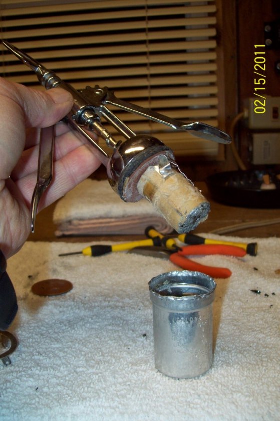 Here it is pulled from the can like a cork from the wine bottle. Note the paper bundle to be 