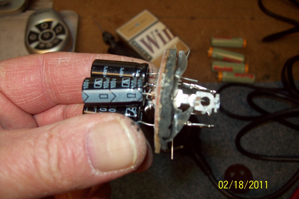 Note orientation of negative stripes on the capacitors.