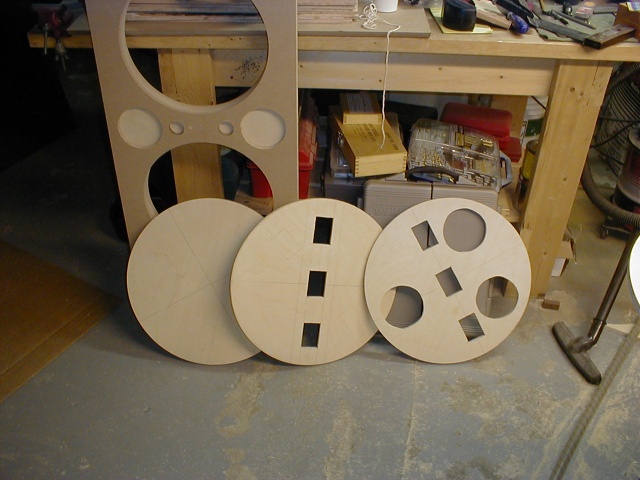 Base comprised of bottom, top, and three drilled-out layers (one shown).