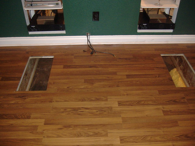 IB - Holes in the floor before manifold and grate installation.