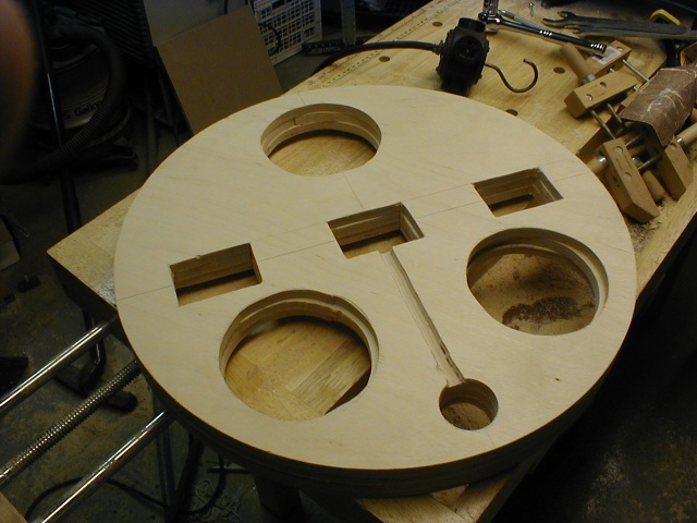 Center layers stacked, with wire track and small hole for binding posts.